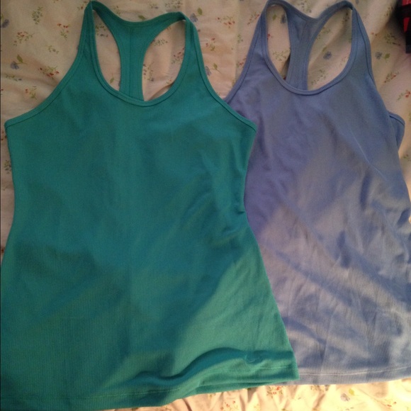 Pair of NIKE DRI FIT TANKS