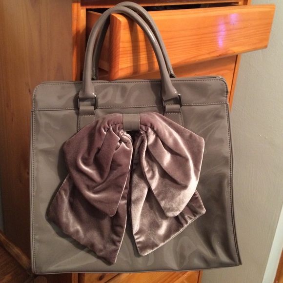 Grey patent faux leather bow top handle bag