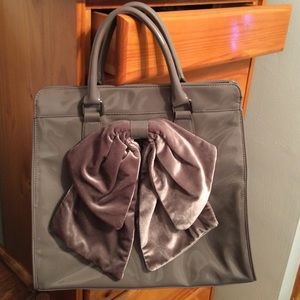 Grey patent faux leather bow top handle bag
