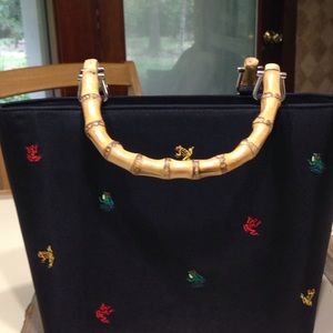 Black purse/ cute color frogs embroidered on it