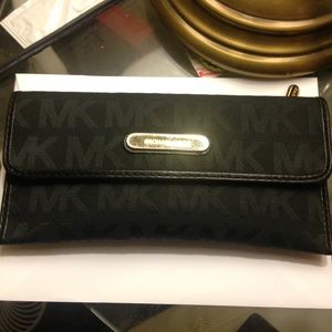 Black Michael Kors flap wallet