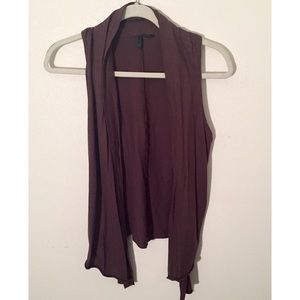 Brown sleeveless blouse.