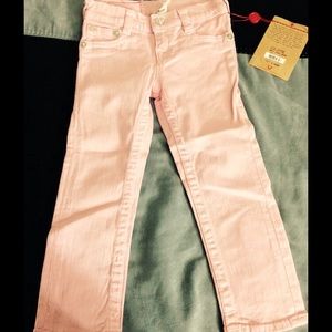 Light Pink True Religion skinny jeans.