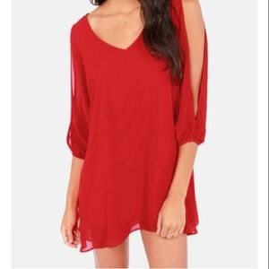 Red dress with arm cutouts on sleeve