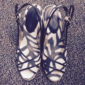 Animal print peep toe wedges with leather lining.