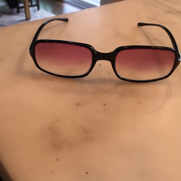 Prada sunglasses and prada case.