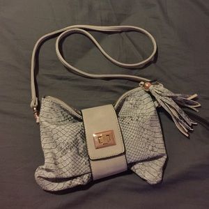 Grey two in one clutch and cross body.