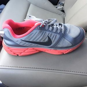 Silver and pink Nikes gently used