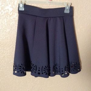 High waisted skirt with cut out floral design.