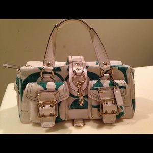 Green and white used Coach bag in good condition
