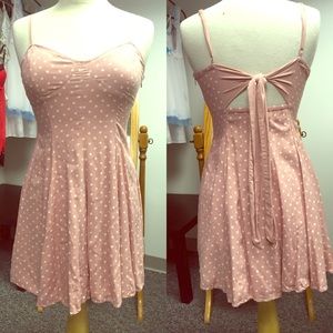 Light pink summer dress with white polka dots.