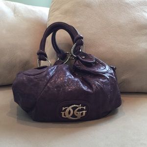 Purple Guess handbag.