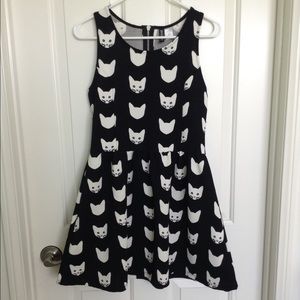Black and white fit and flare cat dress.