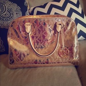Michael Kors rose gold purse.