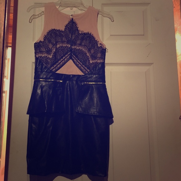 Detailed leather dress. With nude background.