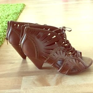 Strapped, peep toe booties