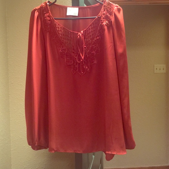An adorable burnt orange chiffon shirt!