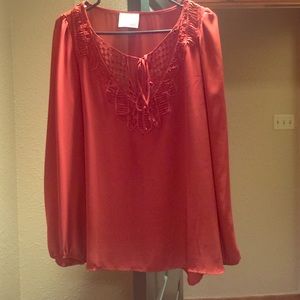 An adorable burnt orange chiffon shirt!