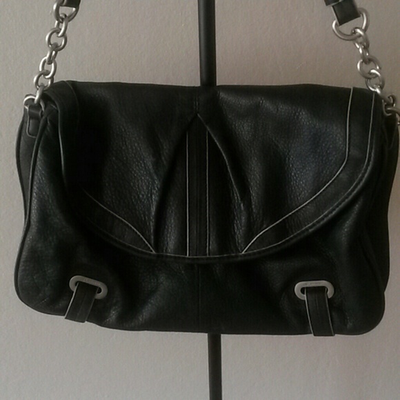 Harldy used black purse/leopard print interior