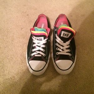 Multi colored tongue black and white converses