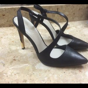 Aldo black heels with gold dipped heels.