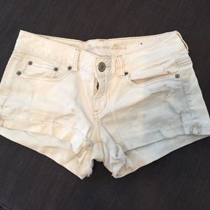 white distressed AE American eagle shorts