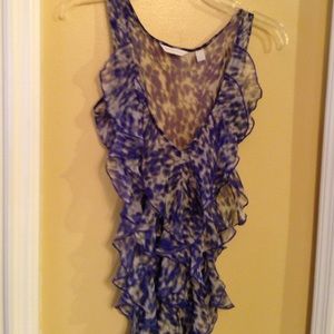 Sleeveless sheer top.