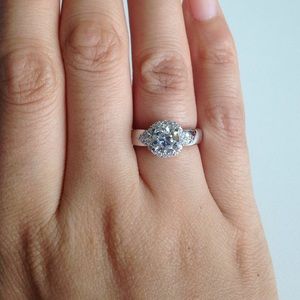 Silver round solitaire with accent engagement ring