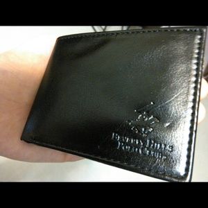 One brand new men's leather wallet