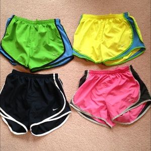 4 pairs of size small Nike dri fit running shorts