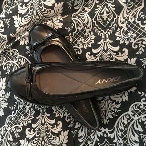 Shiny black DKNY flats