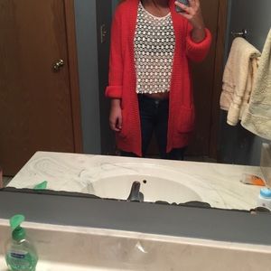 Long orange knitted cardigan