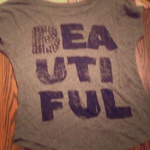 Beautiful shirt, gold jems on it black writing