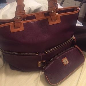 Dooney and Bourke handbag and makeup bag to match.