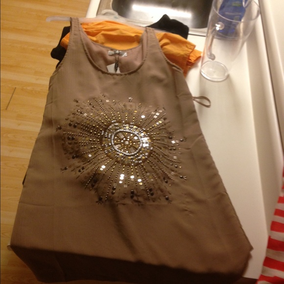 Large tan dress with sequin embellishment