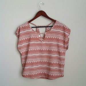 Fun and flowy orange crop top