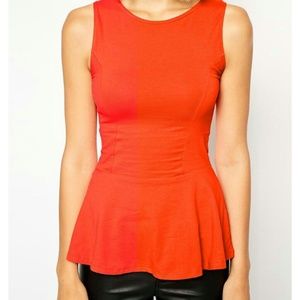 Bright orange/red peplum top