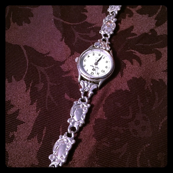 Silver watch with toggle clasp.