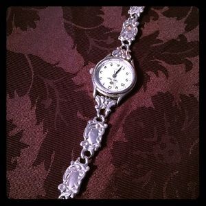Silver watch with toggle clasp.
