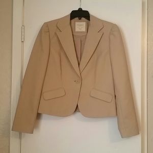 Tan skirt suit.
