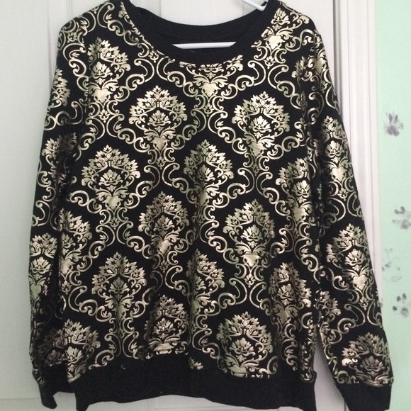 gold and black sweater