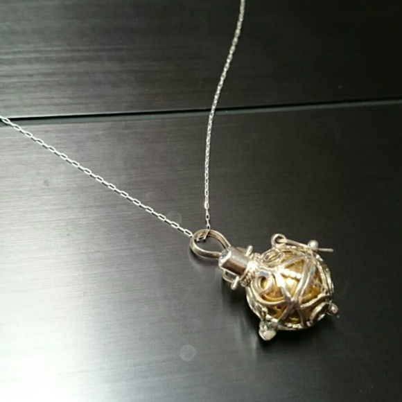 Intricate and Dainty Silver Bottle Necklace.
