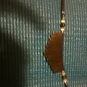 Unique shaved metal pieces to a old organ nacklace