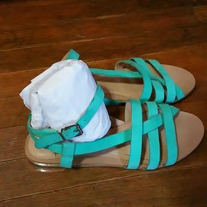 Used. Very cute Turquoise sandals.