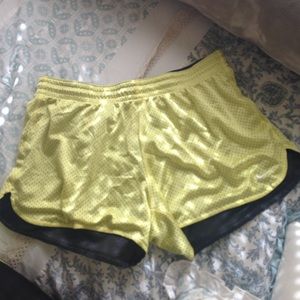 Yellow mesh Nike running shorts