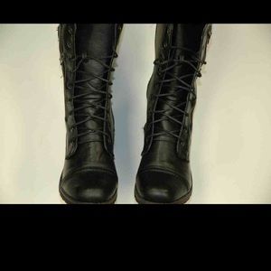 Black combat boots by Dollhouse.