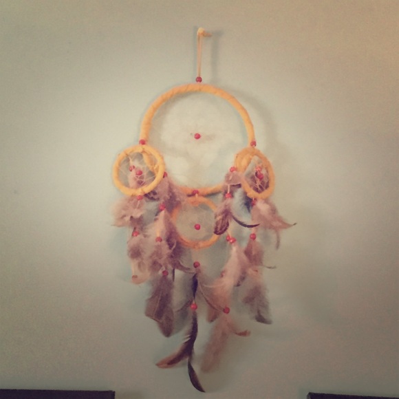 Yellow & feathered dream catcher. Medium sized