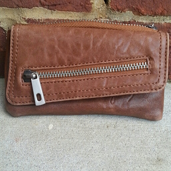 Brown wallet with zippers and snap closure
