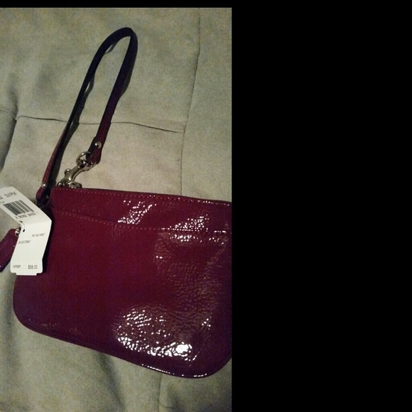 Coach plum wristlet