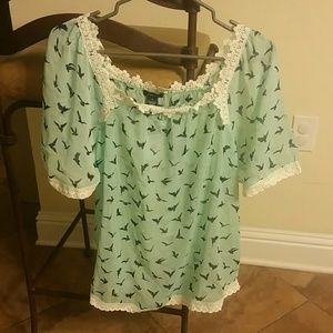 Mint green top with birds